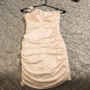 One shoulder off white dress.